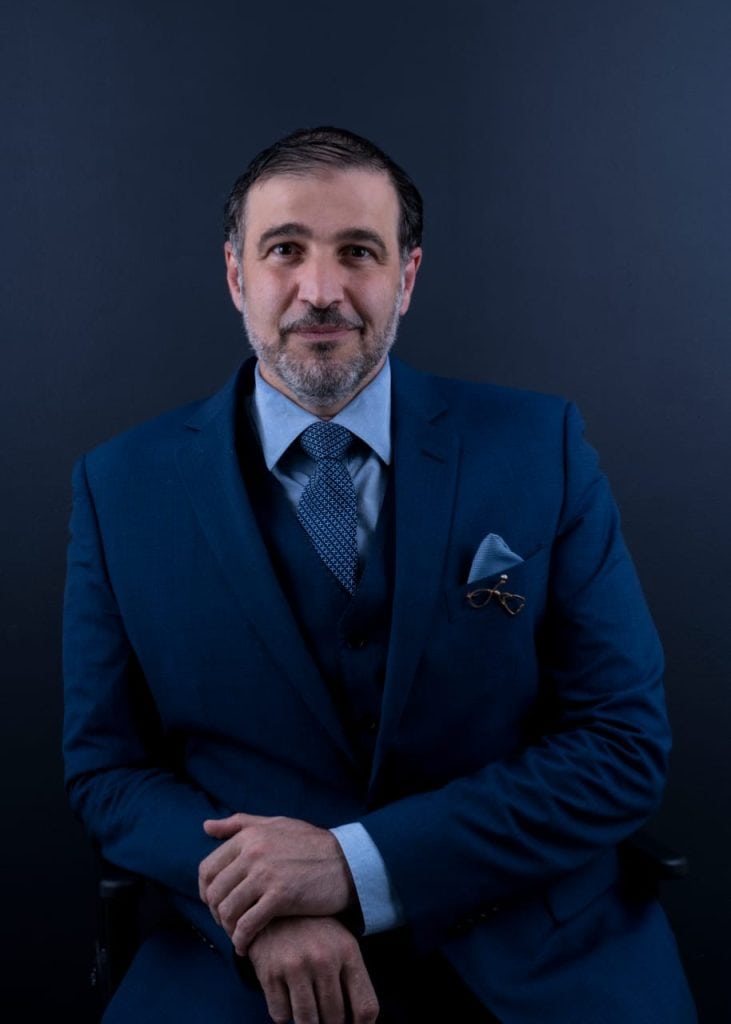 Professional portrait of Dr. Saeed I. Hassan, a board-certified General, Laparoscopic, and Weight Loss Surgeon with 19 years of experience, specializing in laparoscopic sleeve gastrectomy, Allurion gastric balloon, cholecystectomy, hernia repair, and circumcision.